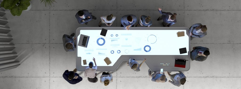 Group of business people with futuristic working desk